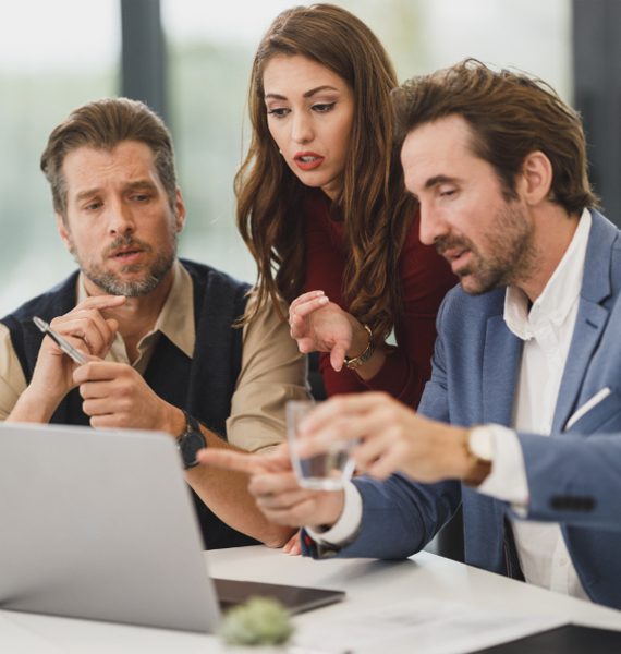 Three colleagues discussing a project